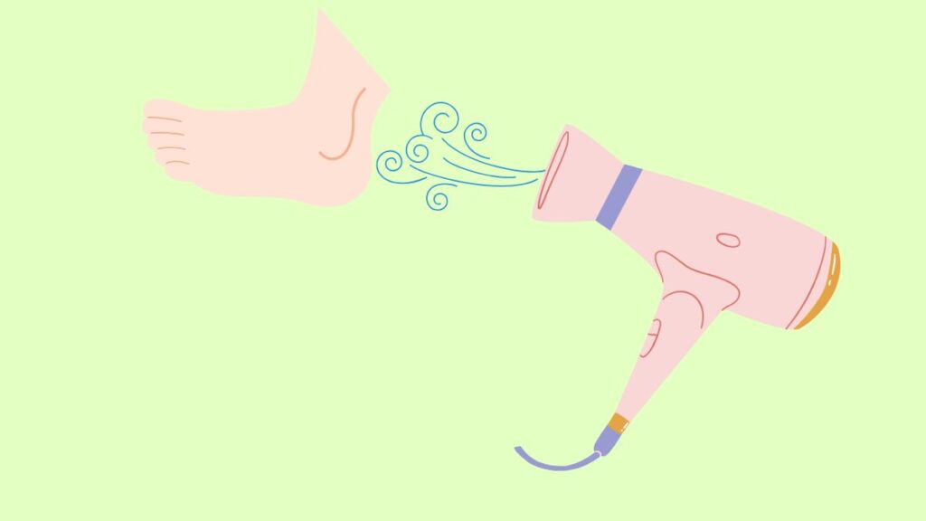 足首にドライヤーの温風を当てているイラスト